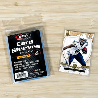 100 Pack BCW Thick Card Sleeves 1-SSLV-Thick (good for patch cards) Package alongside sleeved thick football card pictured