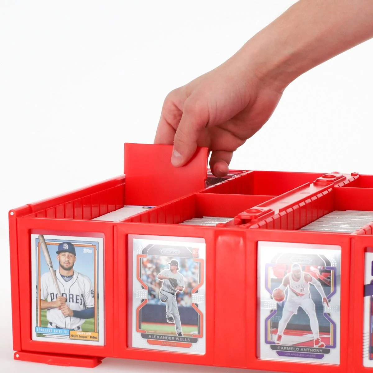 12 Pack Partition Organizers Red Color - 3,200 cards red-color bin with partition in hand being slotted into place. Front of bin displaying baseball and basketball cards